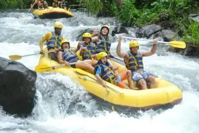 a group of people in a raft on a river at Villa Toto Seminyak in Seminyak