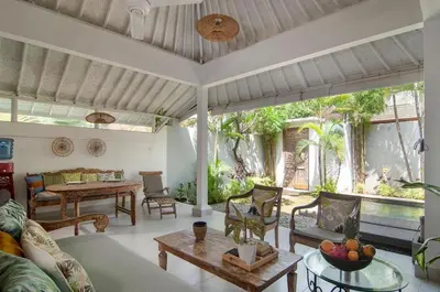 a living room with a couch and a table at AMAZING 1 BR Villa Private Pool walk to beach in Seminyak