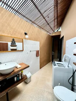 a bathroom with a toilet and a sink at Aesthetic Villa Central Canggu With an Office in Canggu