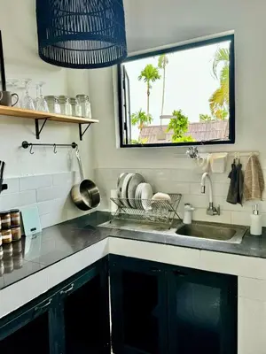 a kitchen with a sink and a window at Aesthetic Villa Central Canggu With an Office in Canggu