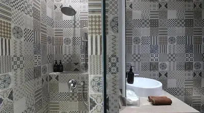 a bathroom with a shower and a white sink at Villa Maisha by REJA Villas in Nusa Dua
