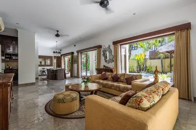 a living room with a couch and a table at Luxury 3-Bedroom Villa With Private Pool Seminyak Village in Seminyak