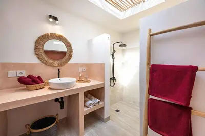 a bathroom with a sink and a mirror at Casa Kokoon - NEW Bright & Quiet 2BR Mertanadi Seminyak with Private Pool and Parking in Seminyak