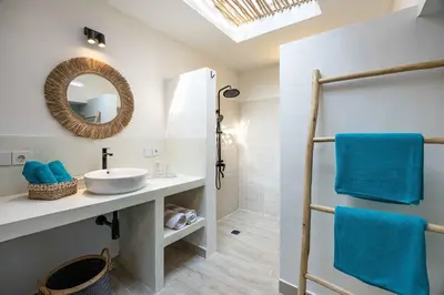 a bathroom with a sink and a mirror at Casa Kokoon - NEW Bright & Quiet 2BR Mertanadi Seminyak with Private Pool and Parking in Seminyak