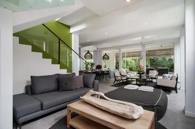 a living room with a couch and a table at Villa Stella Seminyak in Seminyak