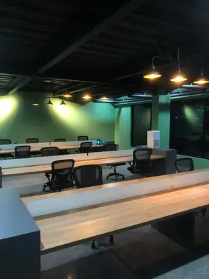 a large conference room with tables and chairs at Alzeto Coliving in Legian