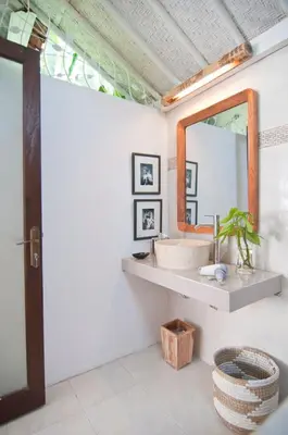 a bathroom with a sink and a mirror at COZY 2 BR Villa Private POOL walk to the beach in Badung