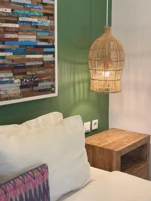 a room with a couch and a table and a lamp at FANTASTIC 1 BR VILLA PRIVATE POOL WALK TO BEACH in Badung