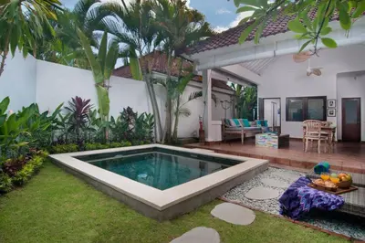 a swimming pool in the yard of a house at FANTASTIC 1 BR VILLA PRIVATE POOL WALK TO BEACH in Badung