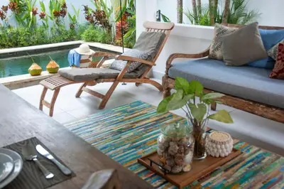 a living room with a couch and a table at FANTASTIC 1 BR VILLA PRIVATE POOL WALK TO BEACH in Badung