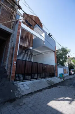 a building with a gate with a fence at Mezzanine Luxury Smart Room - Sanur in Sanur