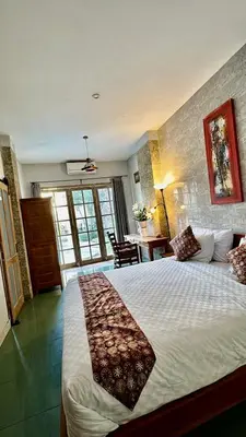 a bedroom with a large bed in a room at Blue Diamond Residenses Seminyak in Seminyak