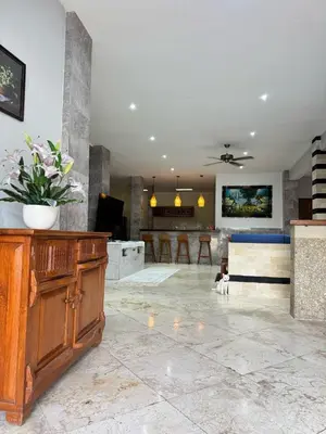 a large living room with a couch and a table at Blue Diamond Residenses Seminyak in Seminyak
