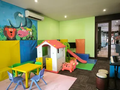 a play room with a table and a play set at Watermark Hotel & Spa Bali in Jimbaran