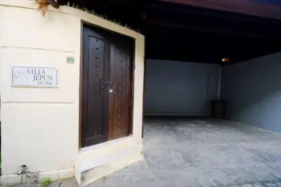 a door to a building with a sign on it at Villa Jepun Seminyak in Canggu