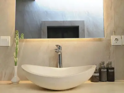 a white sink in a bathroom with a mirror at Villa Sinergi Seminyak 5 in Seminyak