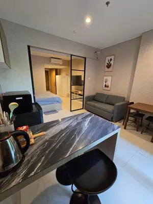 a kitchen and living room with a counter top at de Asasta Apartment Benoa E-105 in Nusa Dua