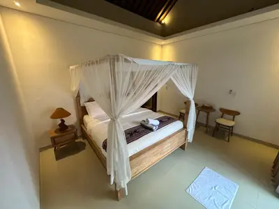 an aerial view of a bedroom with a canopy bed at Villa Lil'u in Seminyak