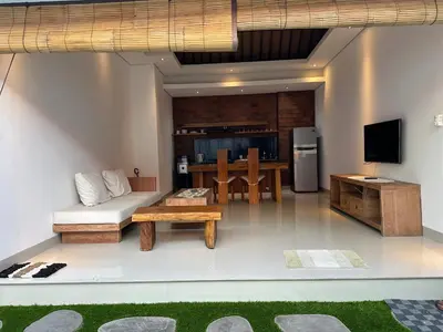 a living room with a couch and a table at Villa Lil'u in Seminyak