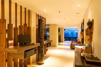a lobby with a computer on a desk in a building at d'primahotel Petitenget Seminyak 2 in Seminyak