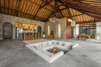 a large living room with a white couch and a table at Brand New 4BR Villa with Pool, Sauna & Fire pit close to Nusa Dua and Uluwatu in Jimbaran
