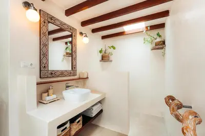 a bathroom with a sink and a mirror at Bali Akasa Villa in Seminyak