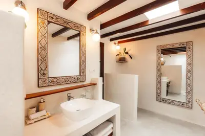 a bathroom with a sink and a mirror at Bali Akasa Villa in Seminyak