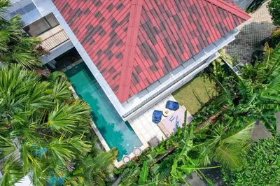 an overhead view of a building with a swimming pool at Twin Villas Drupadi 8BR Seminyak by Exotic Bali Properties in Seminyak