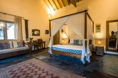 a bedroom with a canopy bed in a room at Villa Damai Manis in Seminyak