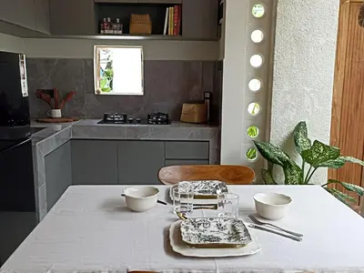 a kitchen with a table with two bowls on it at Villa Juanjo Sanur in Sanur