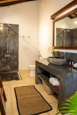 a bathroom with a sink and a shower at The Clovewood Villa in Seminyak