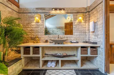 a bathroom with a sink and a mirror at Tropical Villas - 2 Bed & 3 Bed in Kerobokan