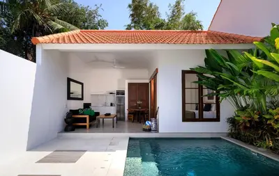 a villa with a swimming pool in front of a house at Gorgeous 1 Bed Pool Villa, Walk to Beach, Shops in Seminyak