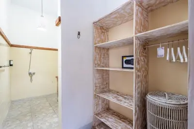 a walk in closet with a brick wall at Just a 3 min stroll to the Seminyak beach in Badung