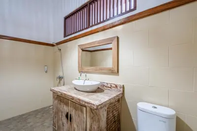 a bathroom with a sink and a toilet at Just a 3 min stroll to the Seminyak beach in Badung