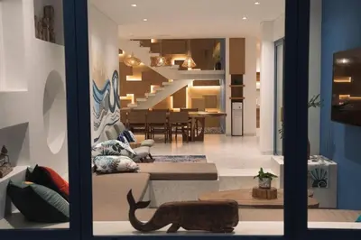 a view of a living room with a cat sitting on a couch at Stunning Sea Front Villa 4BR Nusa Dua in Badung
