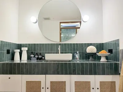a bathroom with a sink and a mirror at Villa Gamelan Bohème Chic Bali in Seminyak