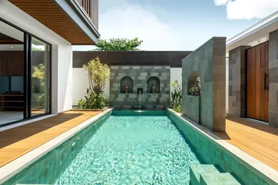 a swimming pool in the backyard of a house at Villa Loema in Kerobokan