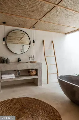 a bathroom with a sink and a large mirror at Villa Massilia Bali in Seminyak