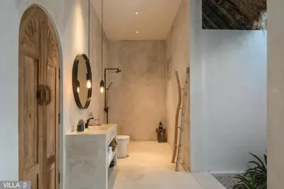 a bathroom with a sink and a toilet at Villa Massilia Bali in Seminyak