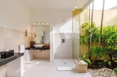 a bathroom with a sink and a mirror at Villa Sitara, Sitara Villa Group in Seminyak
