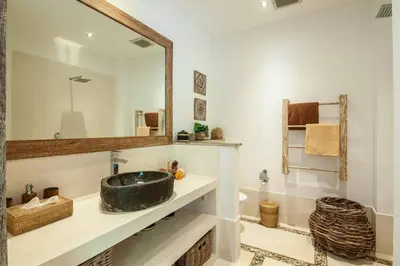 a bathroom with a sink and a mirror at Modern 4bd villa, amazing location in Seminyak in Seminyak