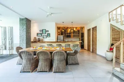 a dining room with a table and chairs at Modern 4bd villa, amazing location in Seminyak in Seminyak