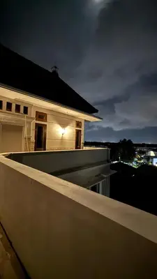 a night view of a building on a roof at Graha Shanti Guest House in Pulau Serangan