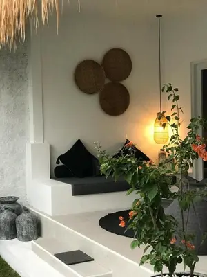a living room with a couch and some plants at Villa Casa Mari in Seminyak
