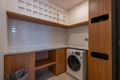 a laundry room with a washer and dryer at 1BR Stylish Loft near airport in Pesanggaran
