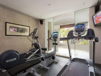 a gym with two tread machines in a room at Villa Lilibel by Elite Havens in Seminyak