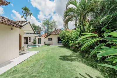 a yard with a pool in a house at Villa Vista 3 Seminyak in Seminyak