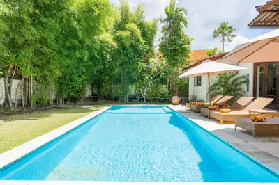 a swimming pool in the backyard of a villa at 9 Bedroom Villa Vista Seminyak in Seminyak