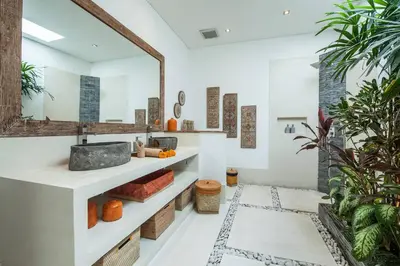 a bathroom with a sink and a mirror at Chill out in a luxurious 4 BR villa Seminyak in Seminyak